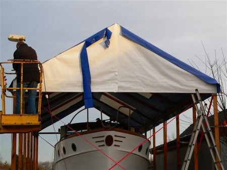 My mate is welding on the gable with a hot air gun