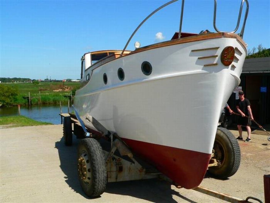 Newly painted boat with renovated bow emblem